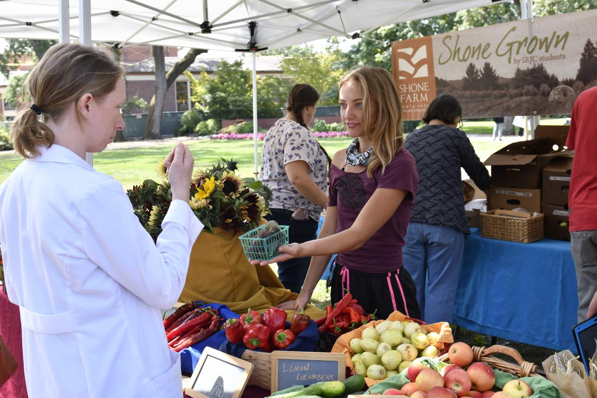 Customers buying produce from students at farm stand on Santa Rosa Junior College campus