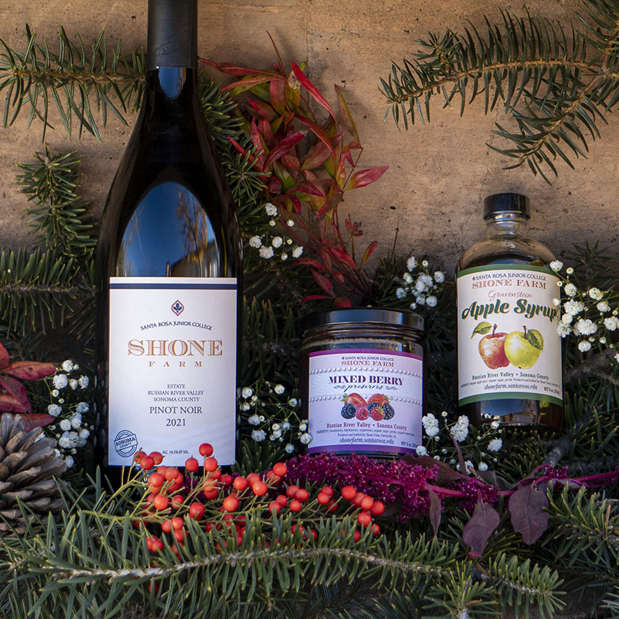 Festive greenery with Shone Farm wine, preserves, and apple syrup